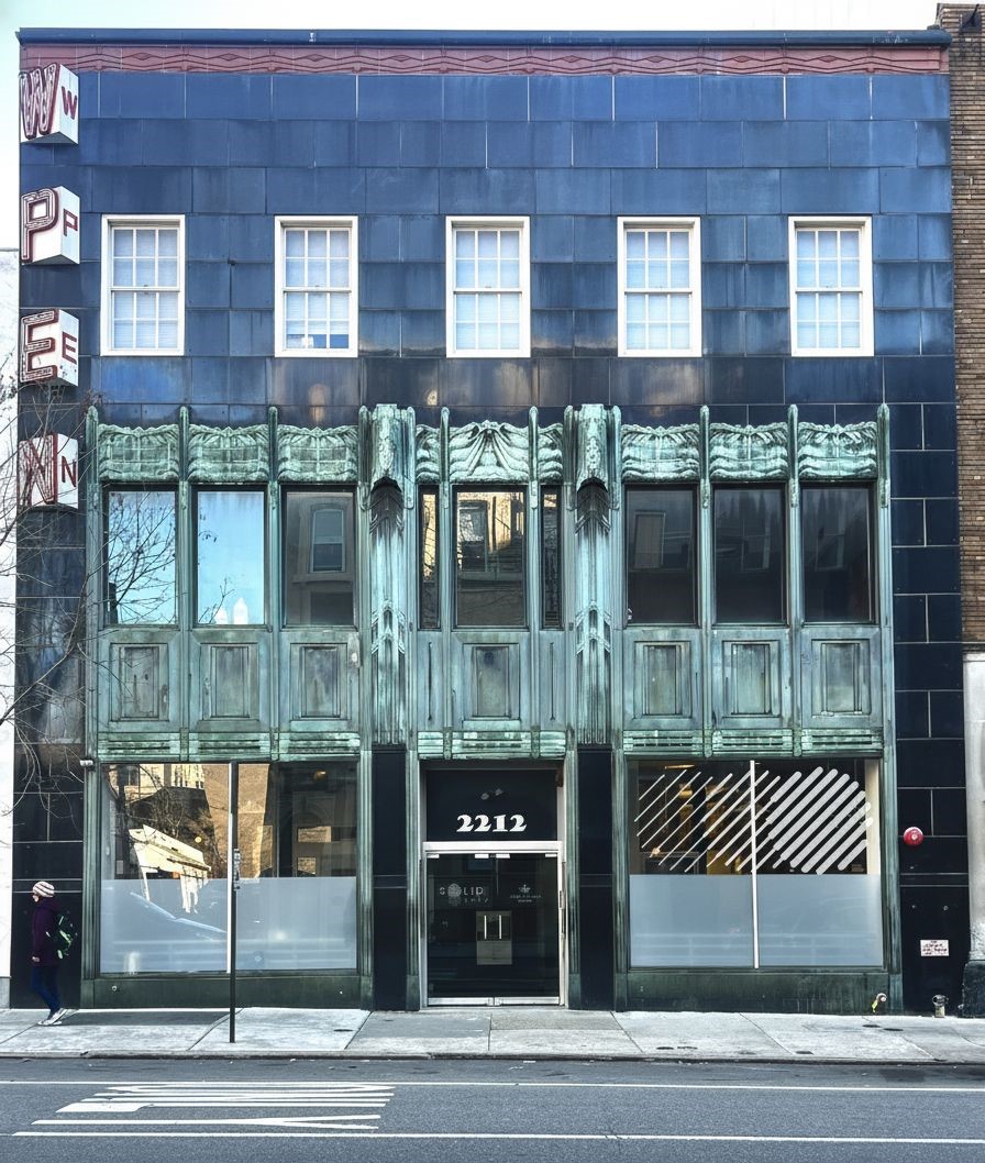 Art Deco building facade at 2212 Walnut Street with blue tile exterior