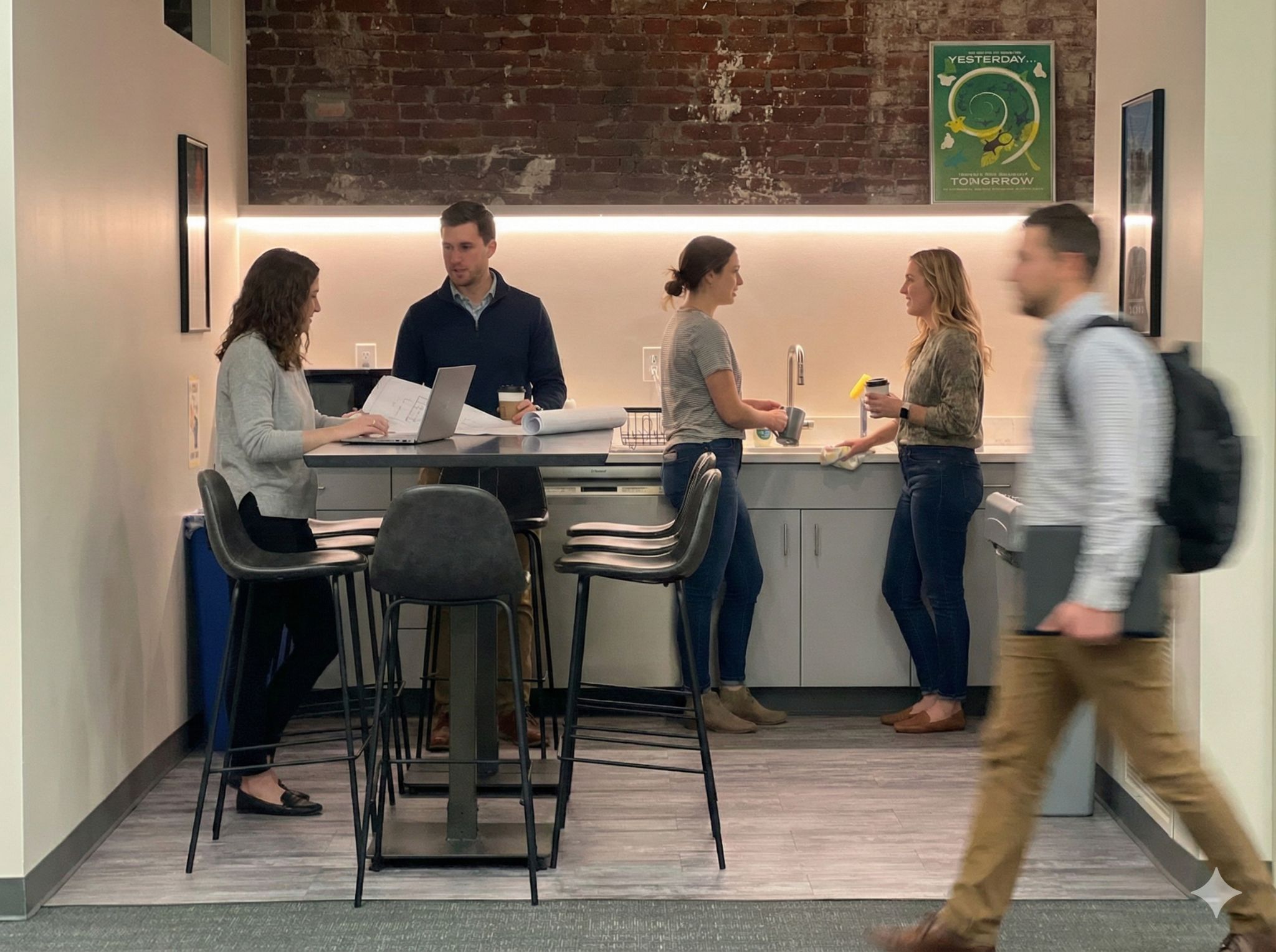 Team collaborating at the Solid Labs kitchen counter workspace