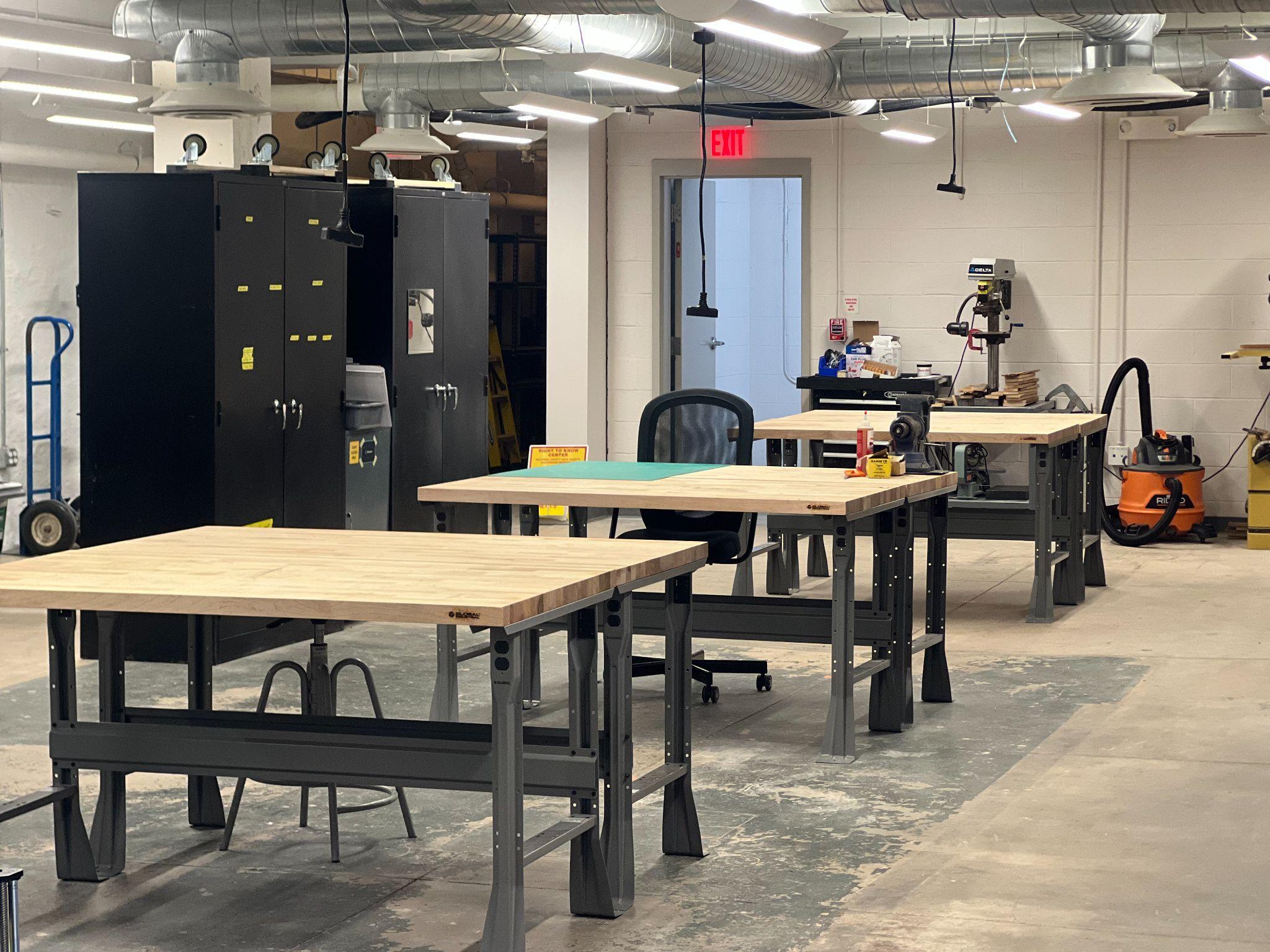 Workshop area with industrial workbenches and equipment storage